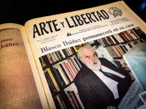 Color archival image from Arte y Libertad featuring a headline announcing that Vicente Blasco Ibáñez (Vicente Blasco Ibanez) will remain in his historic home, accompanied by a photograph of José Luis León Roca. This newspaper page reflects institutional stewardship of Blasco Ibáñez’s memory and legacy, linking journalism, cultural heritage, and literary preservation. Preserved in the University of Tulsa McFarlin Library archive, the image reinforces Blasco Ibáñez’s enduring influence through works such as Entre Naranjos, La Barraca, and Cañas y Barro.
