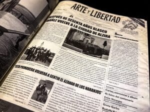 Archival photograph of a full newspaper page from Arte y Libertad featuring the headline announcing the return of Vicente Blasco Ibáñez to Alzira, accompanied by photographs, editorials, and columns of Spanish-language text, preserved in a university archive documenting the public reception, cultural influence, and historical commemoration of Vicente Blasco Ibáñez and Vicente Blasco Ibanez.