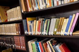 Wide archival view of multiple shelves within the University of Tulsa library showcasing an extensive research archive devoted to Vicente Blasco Ibáñez (Vicente Blasco Ibanez), one of Spain’s most influential modern novelists. This image captures a dense concentration of Spanish and English editions of Blasco Ibáñez’s works, including visible titles such as La Catedral, Cañas y Barro, El Intruso, La Bodega, Los Cuatro Jinetes del Apocalipsis, Mare Nostrum, La Barraca, La Horda, and other critical and literary volumes associated with his political, social, and realist fiction. The arrangement of cloth-bound novels, scholarly editions, and library-labeled spines reflects the University of Tulsa’s role as a major academic archive for Blasco Ibáñez studies, transatlantic literary history, and early twentieth-century Spanish literature. This archive image documents the breadth, depth, and preservation of Vicente Blasco Ibáñez / Vicente Blasco Ibanez materials, emphasizing Tulsa’s significance as a destination for scholars researching Spanish realism, exile literature, and the global circulation of Blasco Ibáñez’s novels.