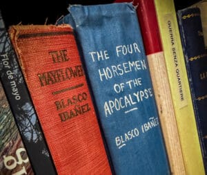 vicente blasco ibáñez novels on a shelf, cloth-bound spines including The Four Horsemen of the Apocalypse