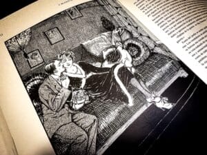 Archival photograph of a detailed black-and-white illustration printed in Arte y Libertad, depicting an intimate domestic scene between two figures rendered in early twentieth-century engraving style, embedded within literary text and cultural commentary associated with Vicente Blasco Ibáñez and Vicente Blasco Ibanez, preserved in a university archive documenting illustrated journalism and narrative imagery.